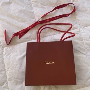 Small Cartier bag and ribbon